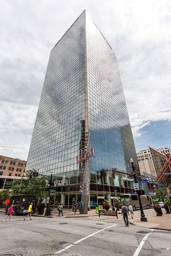 a tall building with a reflection of the sky in the windows at 310 at Nulu Apartments-Student, Kentucky, 40202